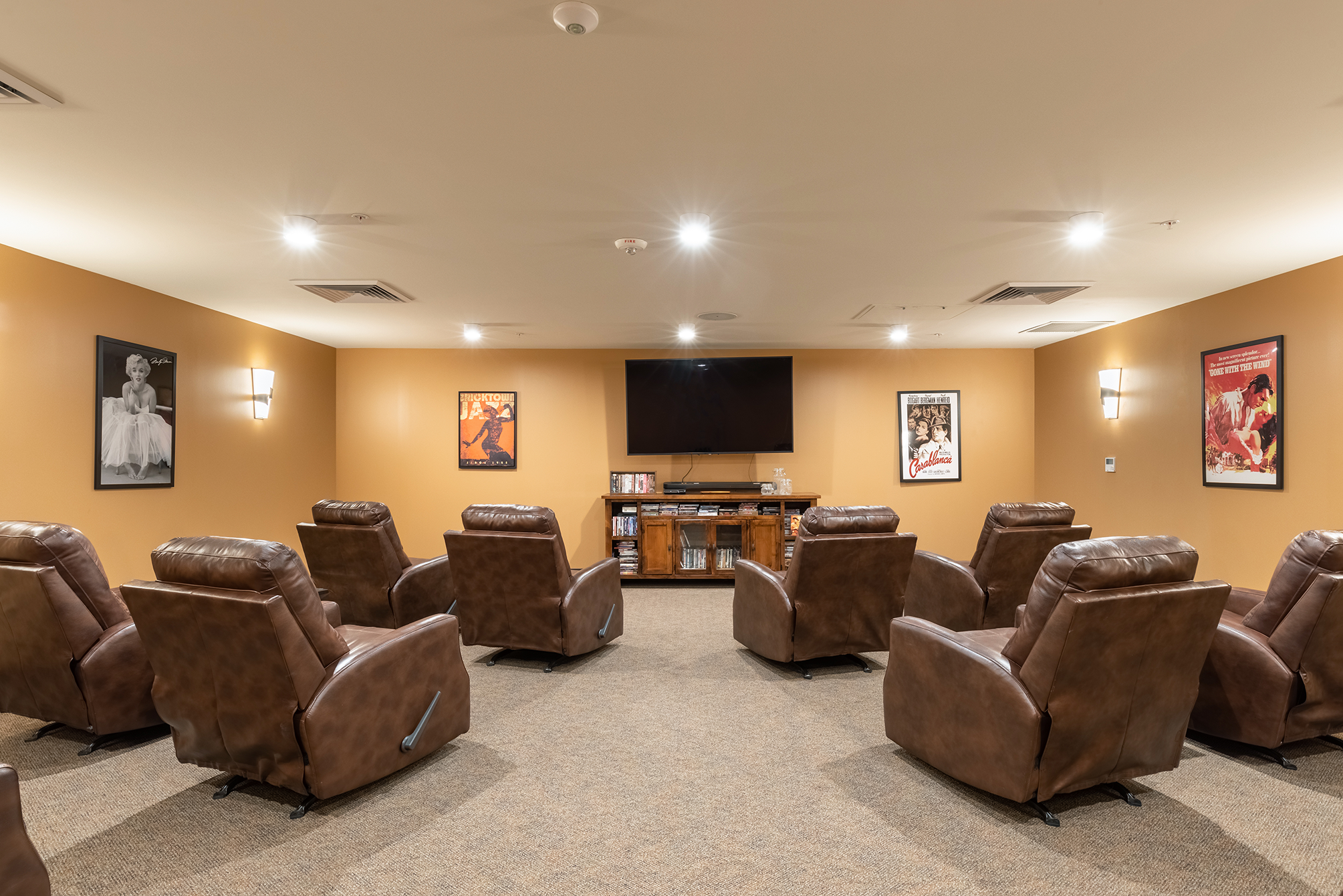 Movie/Theatre room with comfy lounger chairs at The Mission at Agua Fria