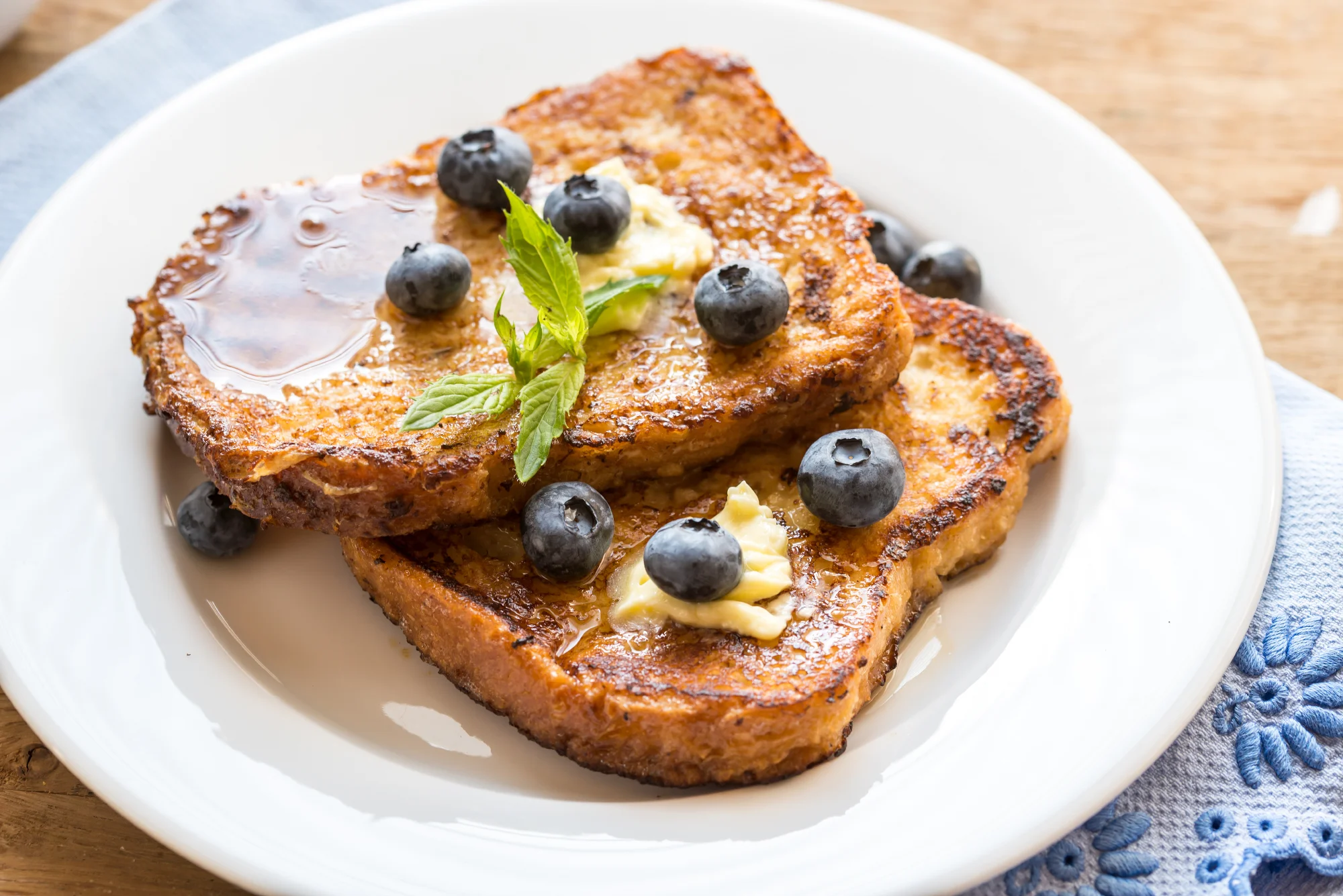 Gourmet french toast with fresh blueberries, Kerrygold Irish butter and real maple syrup.